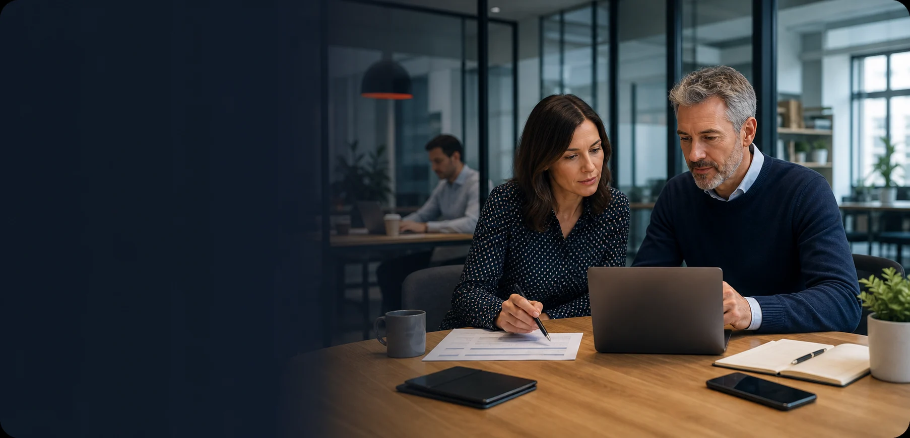 Risk adviser reviewing technology controls with a business leader